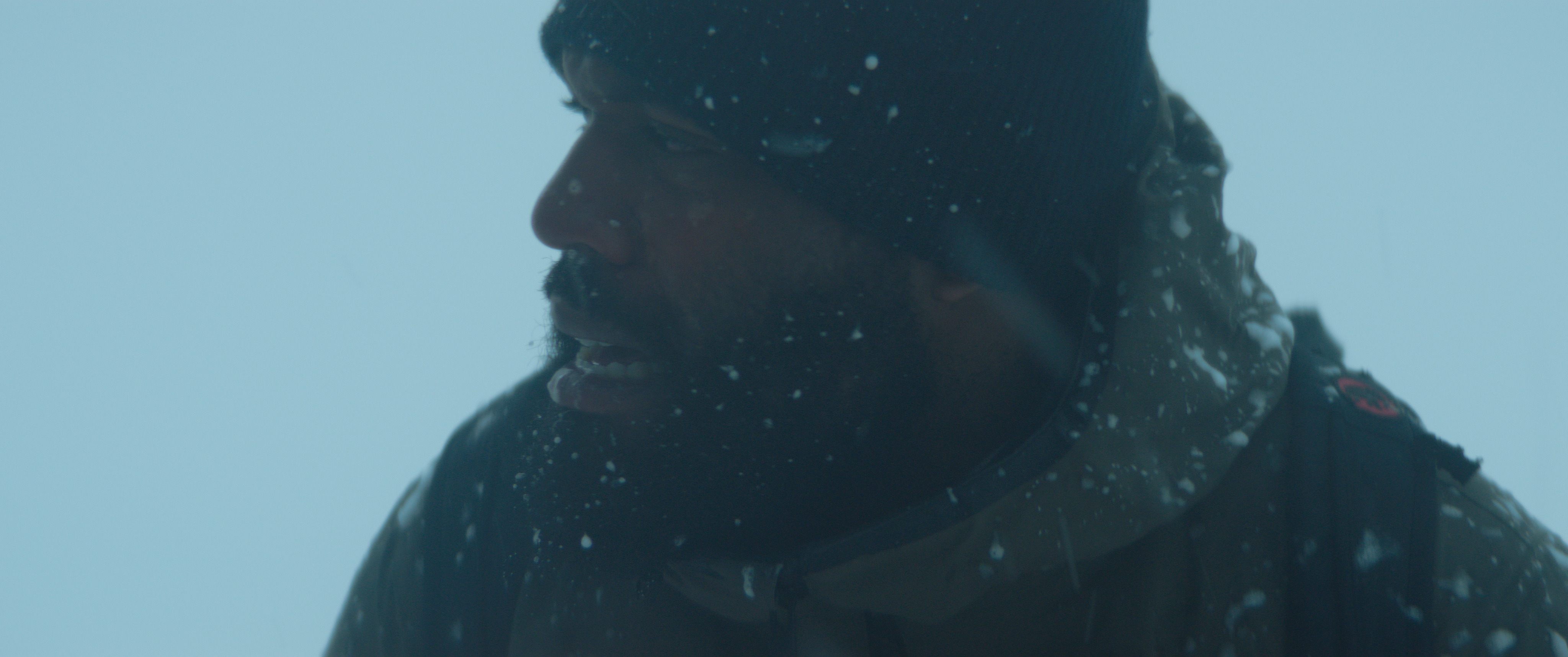Ashim searching through a violent whiteout in Recursive Dreams.
